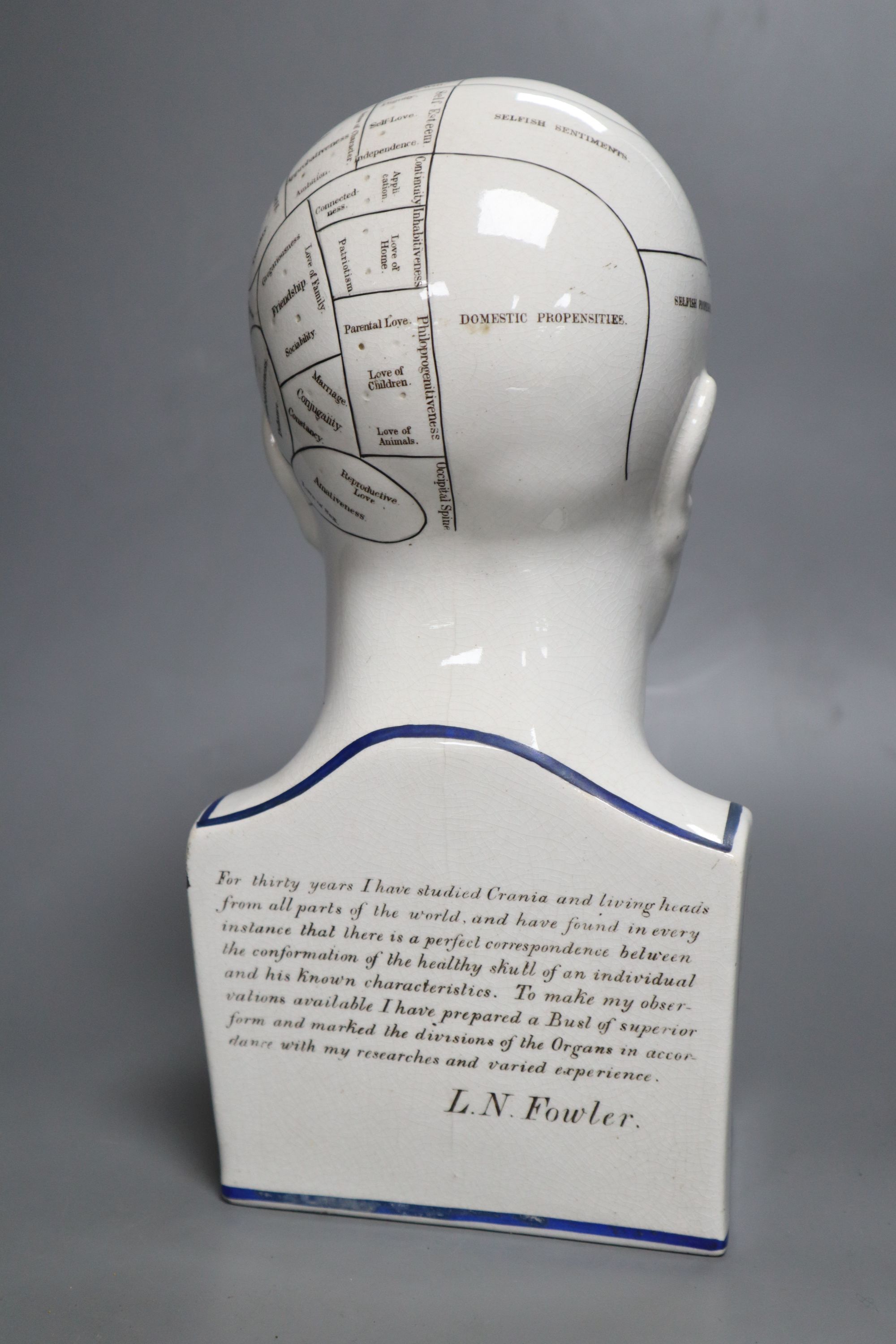 An L.N. Fowler pottery phrenology head, late 19th century, height 29cm